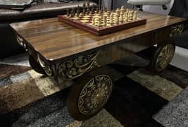 Antique-Style wooden coffee table with Carved wheel design