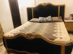 Black and gold wooden bed