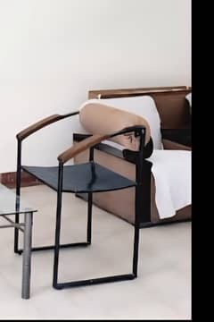 iron chair and glass table