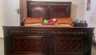 wooden double bed with 2 side tables
