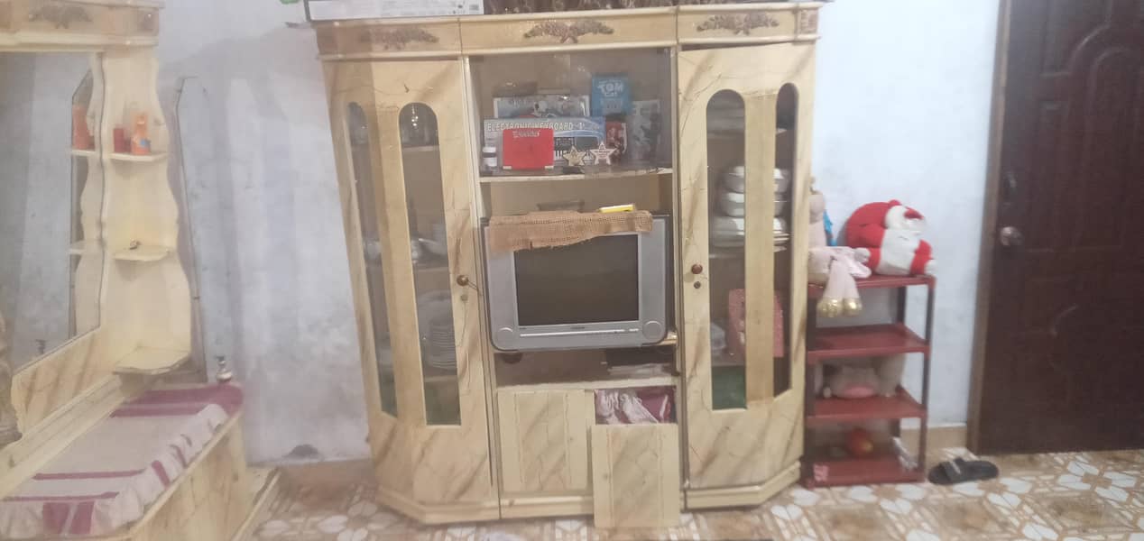 deco bed with 2 side tables and dressing tablea and cabned 4