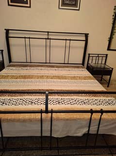 iron rod bed with side tables