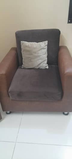 Velvet and leather sofa set with cushions and velvet arm covers