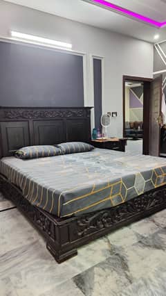 king wooden bed, side table and L. shape dressing