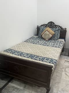 Wooden single bed
