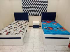 2 Single beds, Without mattress.