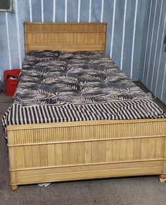 Wooden single bed without mattress