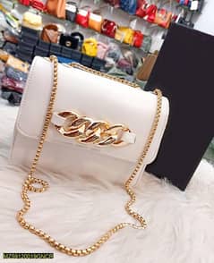 pu leather plain hand bag with long chain strap.