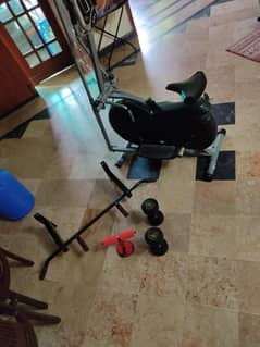 Exeecise bike with wall holderand vacuume halder and dumbels
