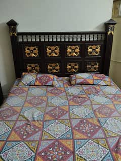 bed with dressing and side table
