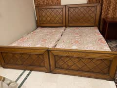 Two single bed with one side table