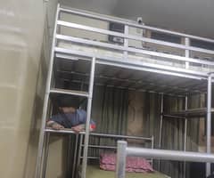 Full size iron bunker bed, with one mattress.