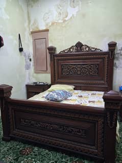 master bed with side tables and dressing