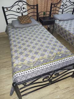 2 Iron Rod Bed with side table.