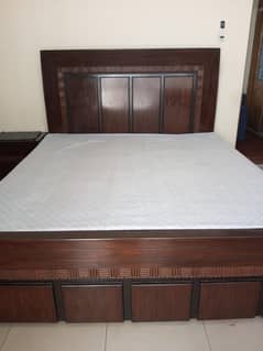 king size bed with two side table and dressing