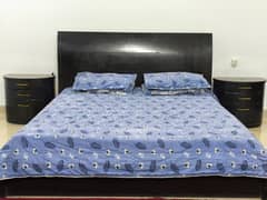 Used bed with side tables and dressing