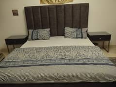 double king size bed with two sides table with glass top