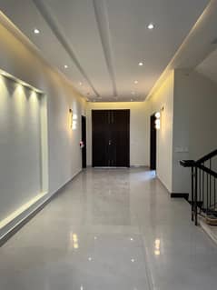 Slightly Used 10 Marla Contemporary Home With Basement, Owner-Tended Interiors, Expansive Lawn, And Secure Street Located In Elite DHA Phase 8 Ex Air Avenue Block Q With Full Utility Access And Peaceful Surroundings, Offered By Emarat Real Estate.