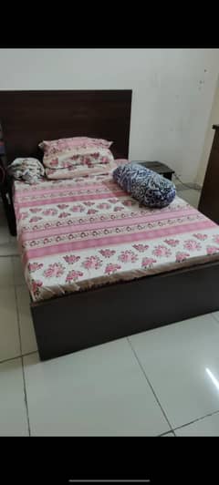 single wooden bed