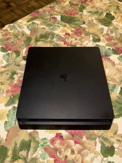 PS4 slim 1tb console with fifa disc and WWE disc along with controller