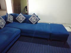 L shaped sofa with tables