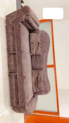 Wooden sofa cum bed.