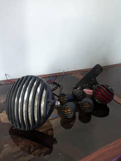 Cafe style metal headlight, indicators and backlight