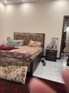 King sized bed with side table, dressing and mirror