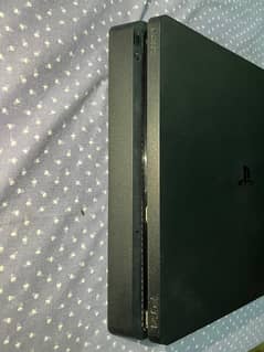 Playstation 4 slim with controllers and disks