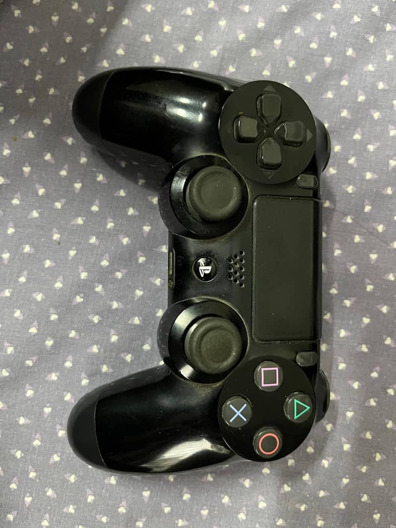 Playstation 4 slim with controllers and disks 1
