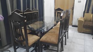 8seater heavy wooden dinning with 12mm glass top