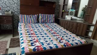 queen size bed with mattress having box on head side