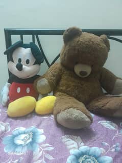 brown big teddy bear and mickey mouse