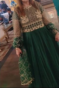 Elegant footlong dark green maxi dress with golden detail on top