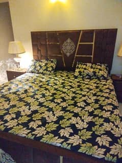kingsize bed with two side tables and mattress