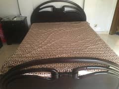 home used queen-size bed without mattress