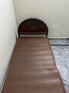 single wooden bed