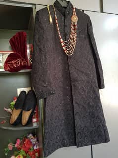 Black sherwani with mehron combination