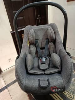 slightly used "Tinnies carry cot and car seat "