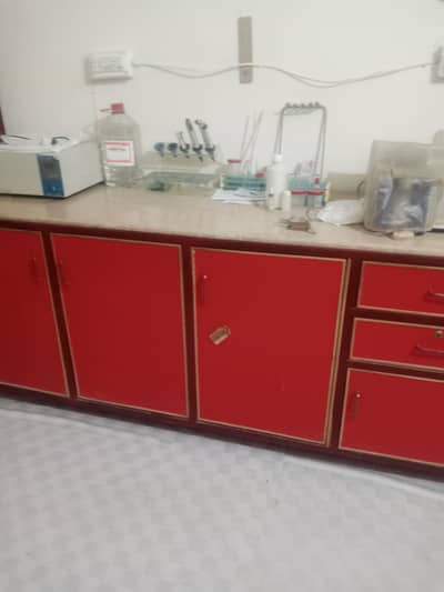 4 iron racks for laboratory instrument . with marble and cabinets