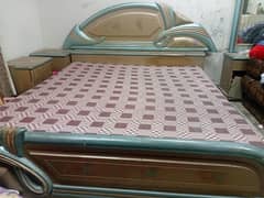 double bed with mattress with dressing table and side table