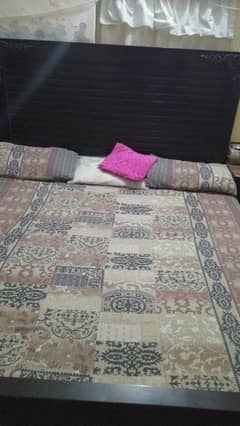 A king size bed with premium quality with seat tables i
