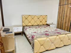 luxury bed with side tables and dressing