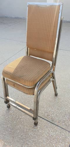 Stainless steel long back chairs.