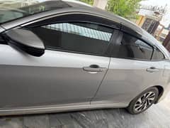 Honda civic 2016 model total geniune car silver colour lahore register