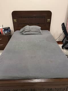 Bed with mattress, side table and dresser