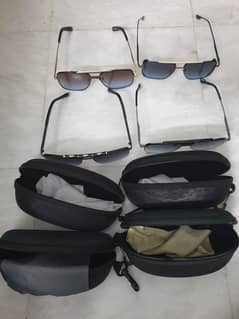 Brand new, imported sunglasses in four styles unisex designs