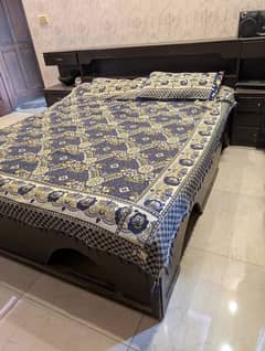 Wooden bed with dressing table and side tables