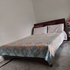 Queen size wooden bed in perfect condition.