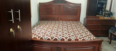 double king size bed with side table and dressing table